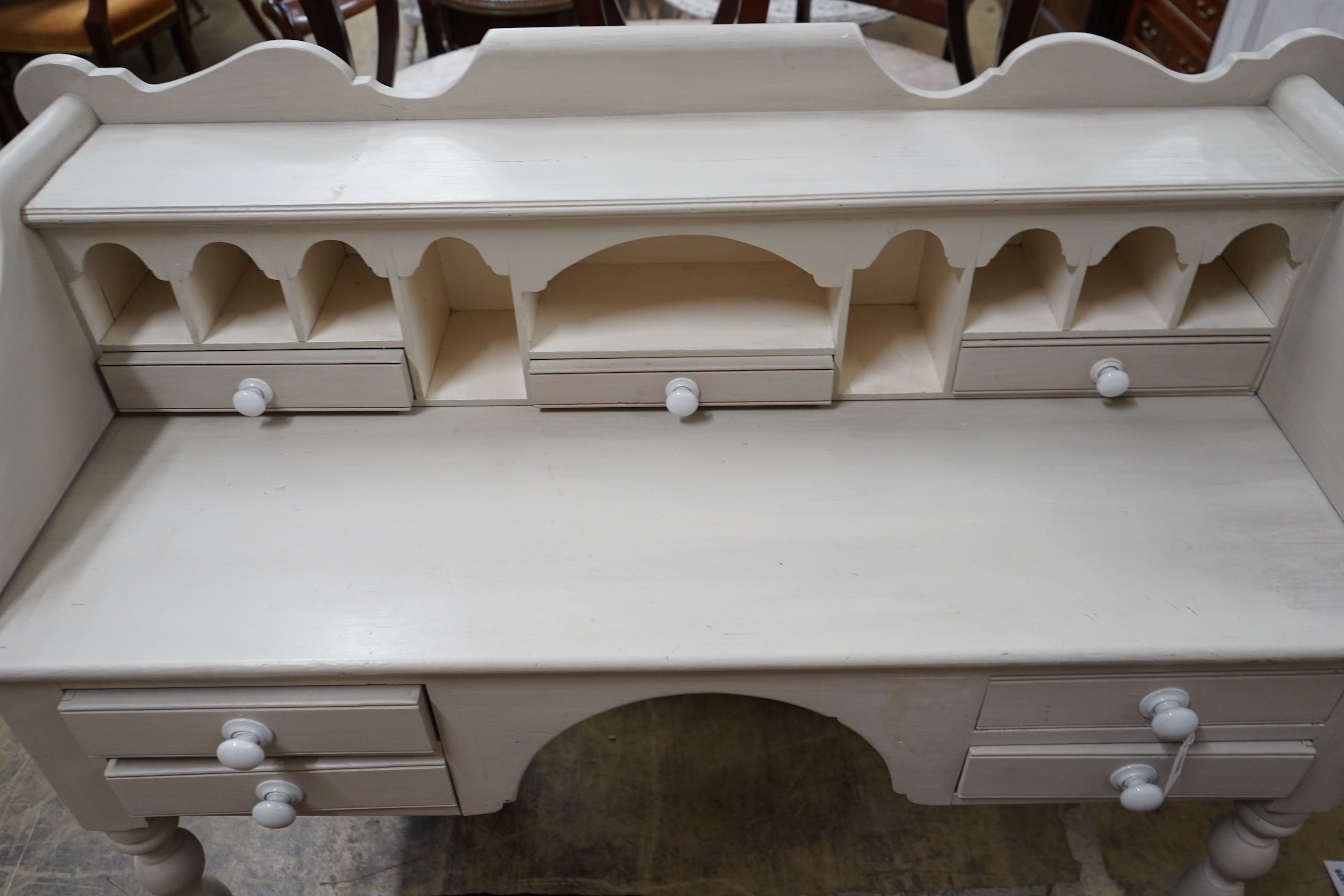 A Victorian style painted pine kneehole dressing table, width 128cm, depth 52cm, height 109cm